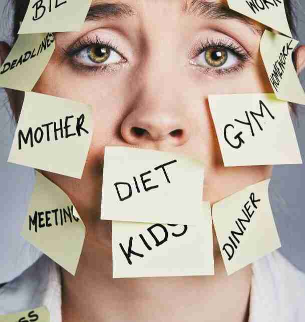 A person with a concerned expression is covered in sticky notes labeled MOTHER, DIET, KIDS, DEADLINES, and more, symbolizing the chaos of daily life. Among the tasks lies a hidden note offering parenting advice, amidst preparations for back-to-school madness.