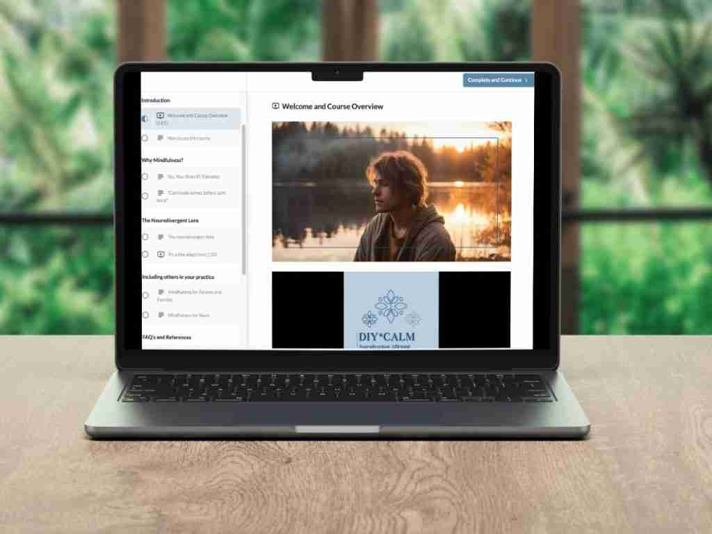 A laptop on a wooden table displays an online course titled “DIY CALM.” The video shows a young man outdoors, with trees and a lake behind him, sharing mindfulness tips for neurodivergent learners; the sectioned course menu appears on the left.