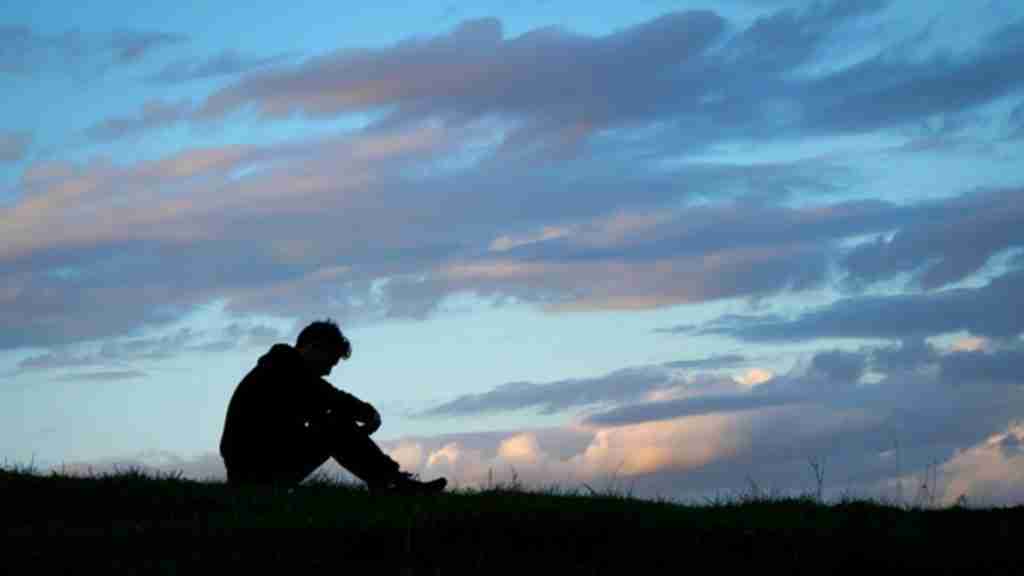 January 2026 blog posts Young man with head down in field